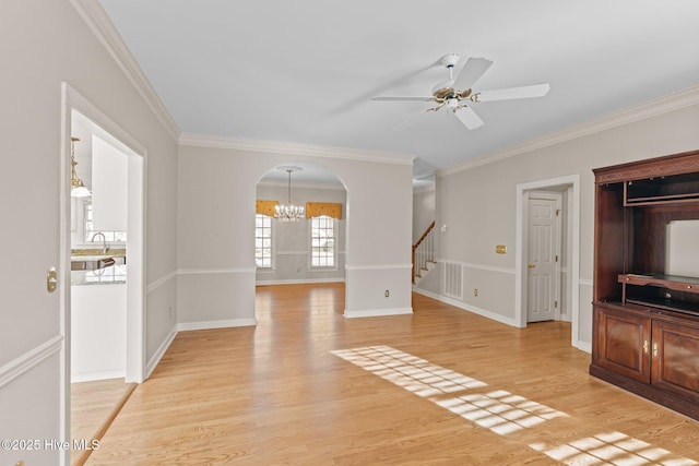 living room featuring sink, ceiling fan with notable chandelier, ornamental molding, and light wood-type flooring