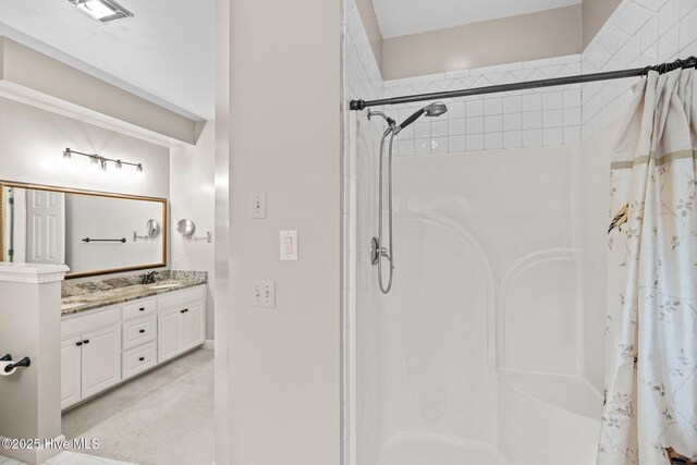 kitchen featuring stainless steel appliances, ornamental molding, light stone countertops, and decorative light fixtures