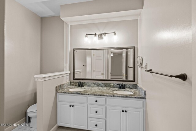 kitchen featuring white cabinetry, sink, stainless steel appliances, and hanging light fixtures