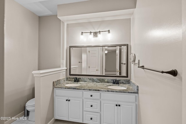 1985 Den Tree Ct, New Bern, NC 28562 - full bathroom featuring double vanity, toilet, baseboards, and a sink