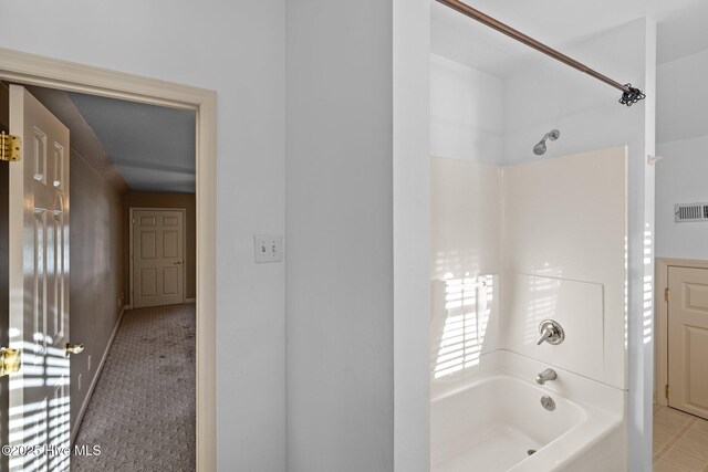 mudroom with crown molding, separate washer and dryer, and light wood-type flooring