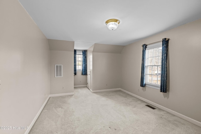 1985 Den Tree Ct, New Bern, NC 28562 - carpeted spare room featuring baseboards, visible vents, and vaulted ceiling
