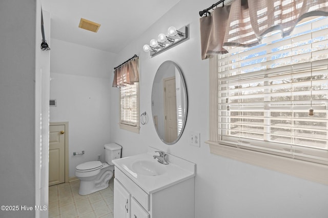 1985 Den Tree Ct, New Bern, NC 28562 - bathroom with toilet, vanity, and visible vents