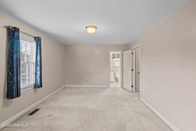 1985 Den Tree Ct, New Bern, NC 28562 - unfurnished room featuring light carpet, baseboards, and visible vents