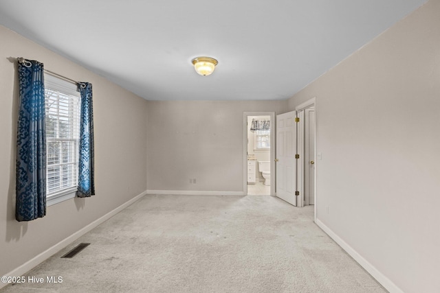 spare room with light colored carpet