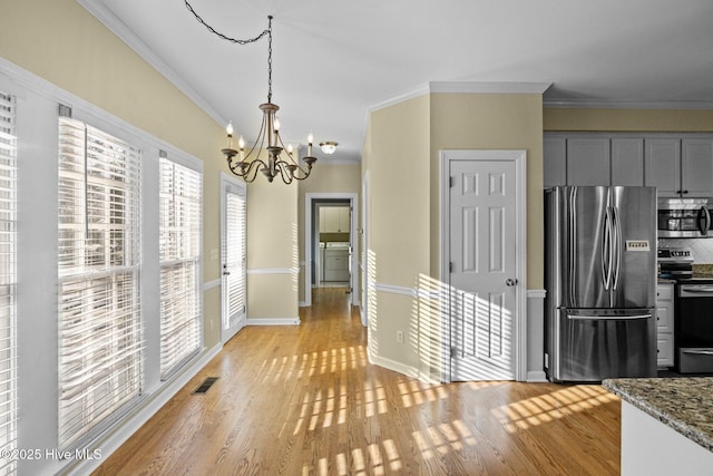 1985 Den Tree Ct, New Bern, NC 28562 - kitchen with stainless steel appliances, crown molding, and light wood finished floors