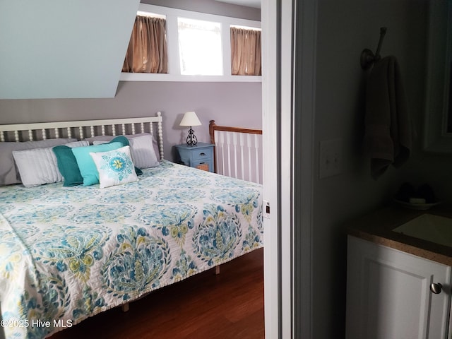 bedroom with wood-type flooring