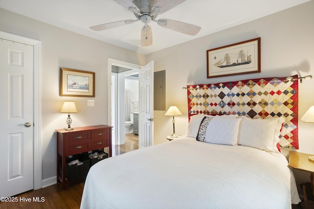 bedroom with dark hardwood / wood-style flooring and ceiling fan