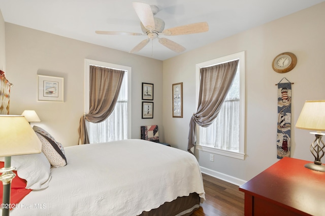 bedroom featuring ceiling fan and dark wood-type flooring