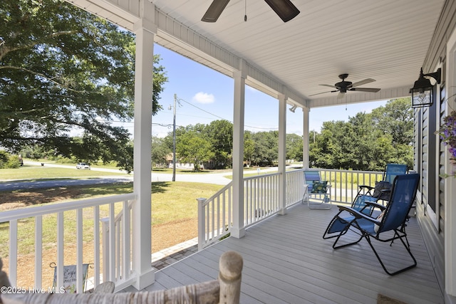 deck with ceiling fan and covered porch