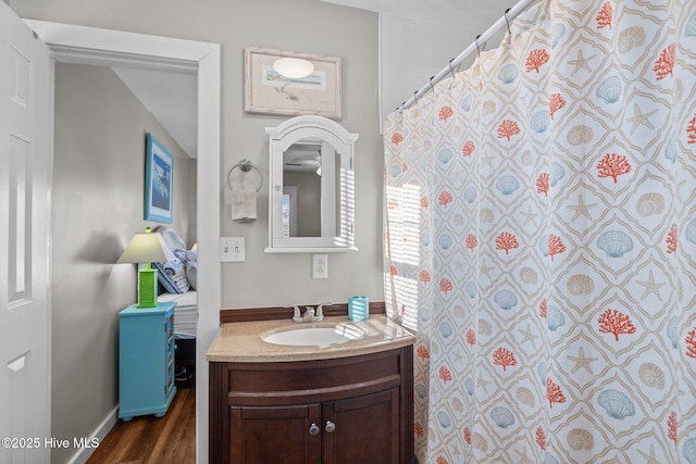 bathroom with hardwood / wood-style floors and vanity