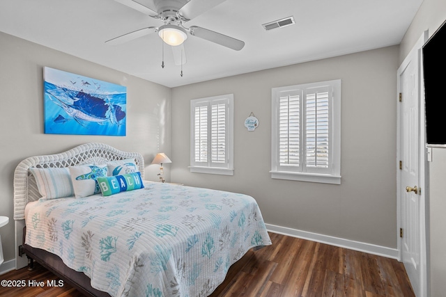 bedroom featuring ceiling fan and dark hardwood / wood-style floors