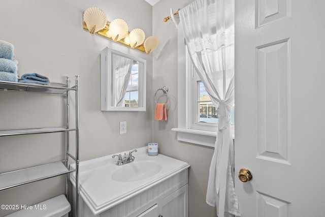 bathroom with a wealth of natural light and vanity