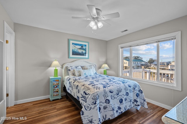 bedroom featuring ceiling fan and dark hardwood / wood-style flooring