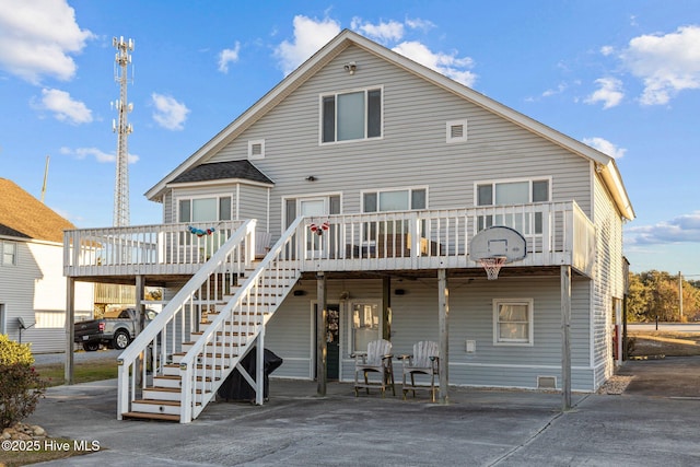 back of house featuring a wooden deck