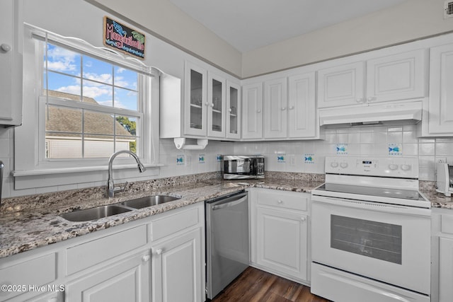 kitchen featuring dark hardwood / wood-style flooring, light stone counters, stainless steel appliances, sink, and white cabinetry