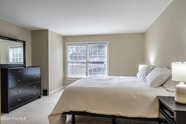 bedroom with light colored carpet