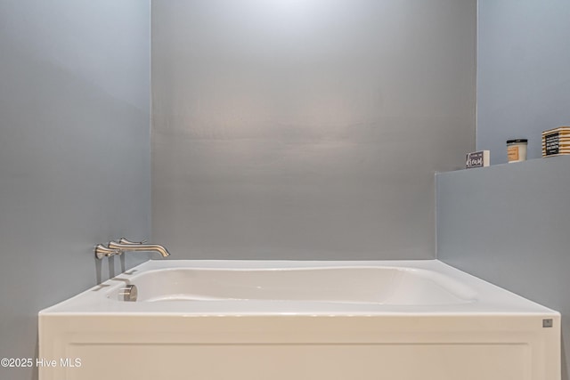 bathroom with a tub to relax in