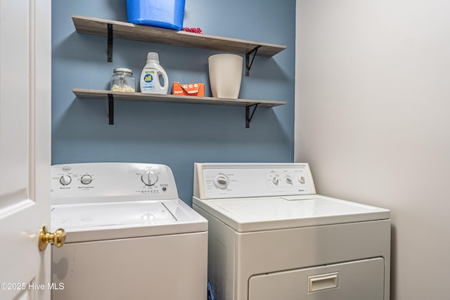 laundry area with washing machine and clothes dryer