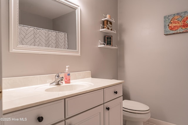 bathroom with vanity and toilet