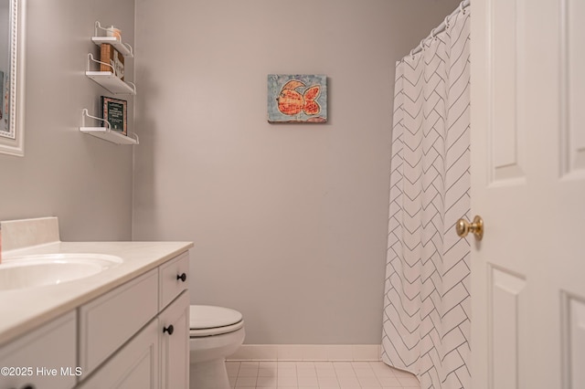 bathroom with a shower with shower curtain, tile patterned flooring, vanity, and toilet