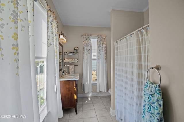 bathroom with vanity, crown molding, tile patterned floors, and toilet