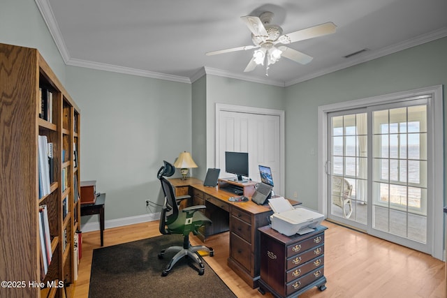 office space featuring crown molding, ceiling fan, and light hardwood / wood-style flooring