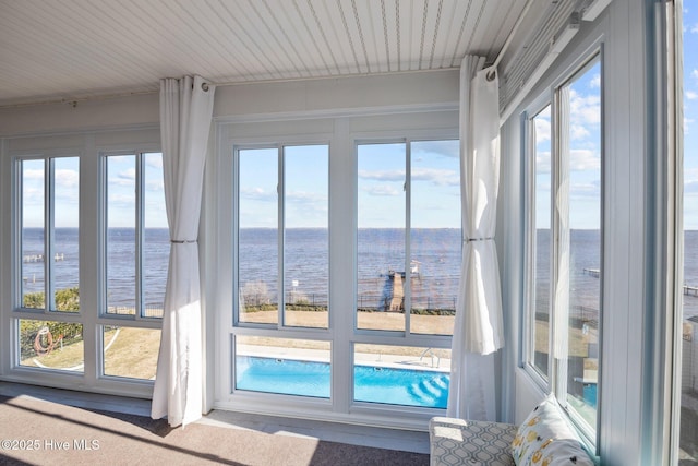 doorway to outside with a water view