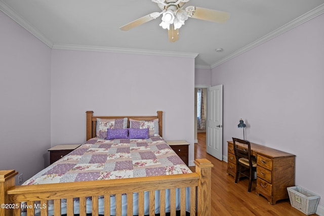 bedroom with crown molding, ceiling fan, and hardwood / wood-style floors