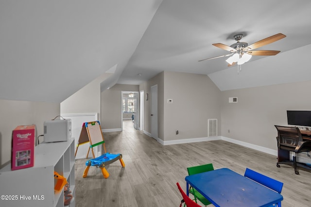 interior space with ceiling fan, light hardwood / wood-style floors, and lofted ceiling