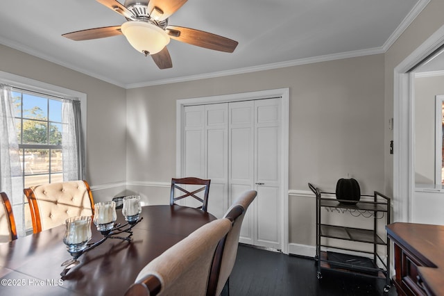 dining area with crown molding, ceiling fan, and dark hardwood / wood-style flooring