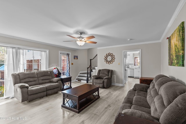 living room with ceiling fan, light hardwood / wood-style flooring, and ornamental molding