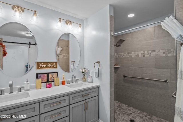 bathroom featuring curtained shower and vanity