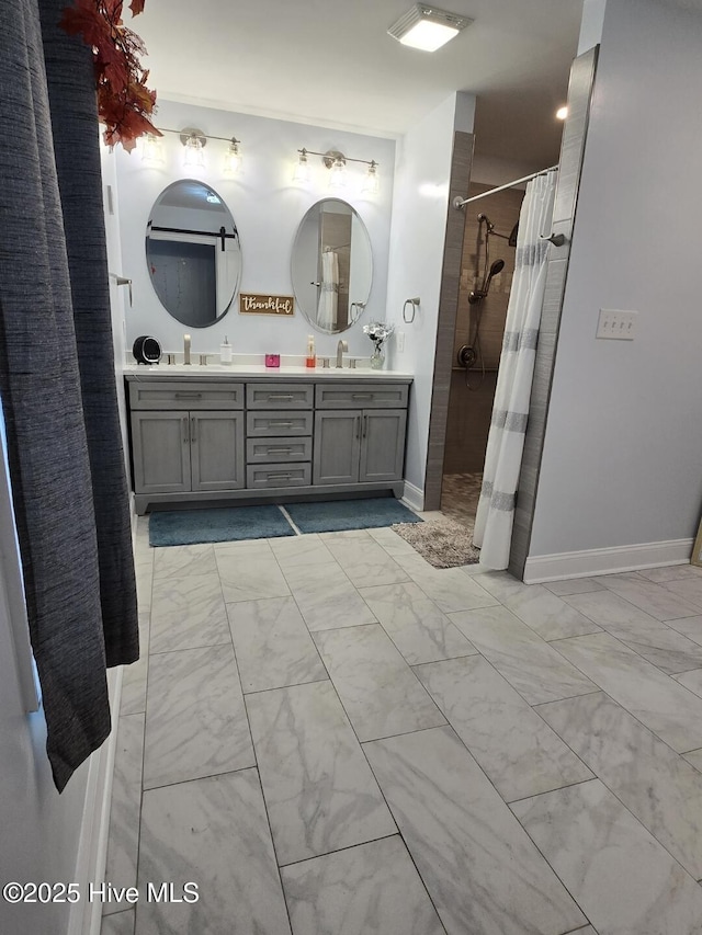 bathroom featuring curtained shower and vanity