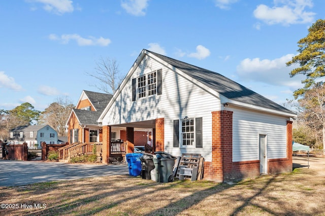 view of side of home featuring a yard