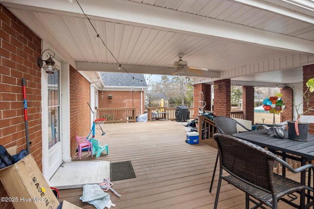 wooden deck with ceiling fan