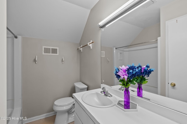 full bathroom featuring shower / washtub combination, toilet, lofted ceiling, and vanity