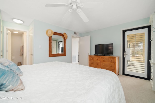 carpeted bedroom featuring ceiling fan and multiple windows