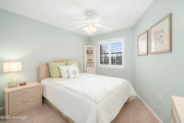 bedroom featuring ceiling fan and light colored carpet