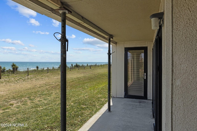 view of patio with a water view