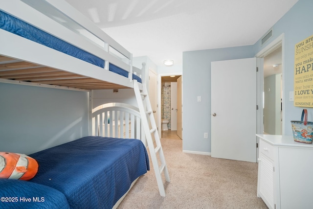 bedroom with light colored carpet