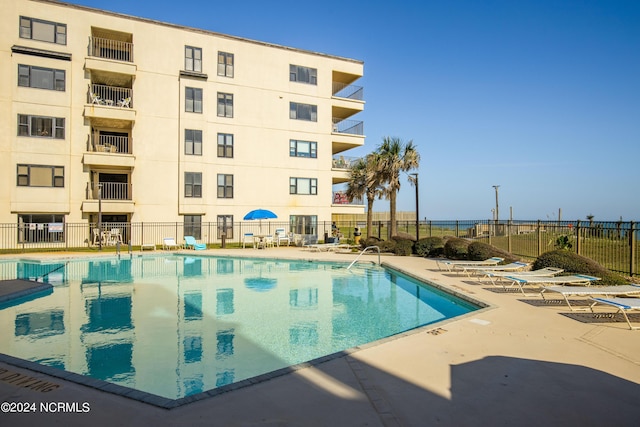 view of pool featuring a patio