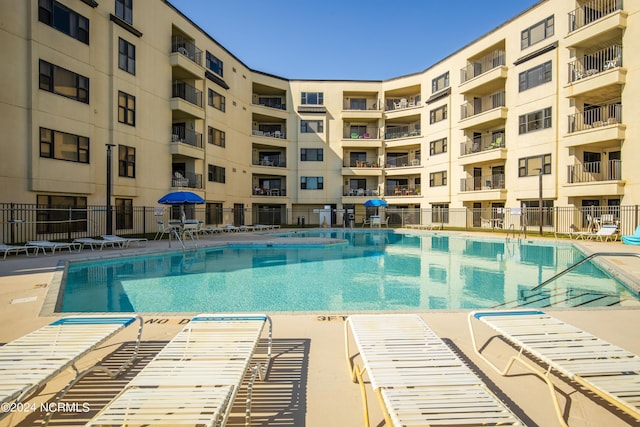 view of swimming pool featuring a patio area