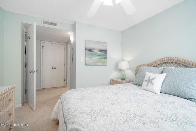 bedroom featuring ceiling fan and light carpet