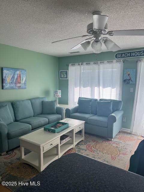 living room featuring a textured ceiling