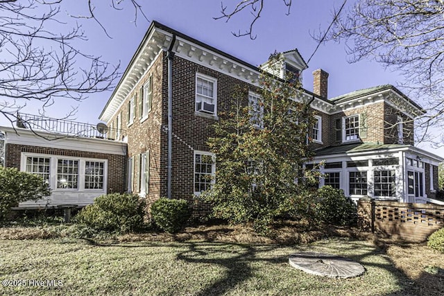 back of house featuring a yard