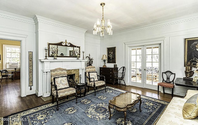 living room with french doors, plenty of natural light, and dark hardwood / wood-style floors