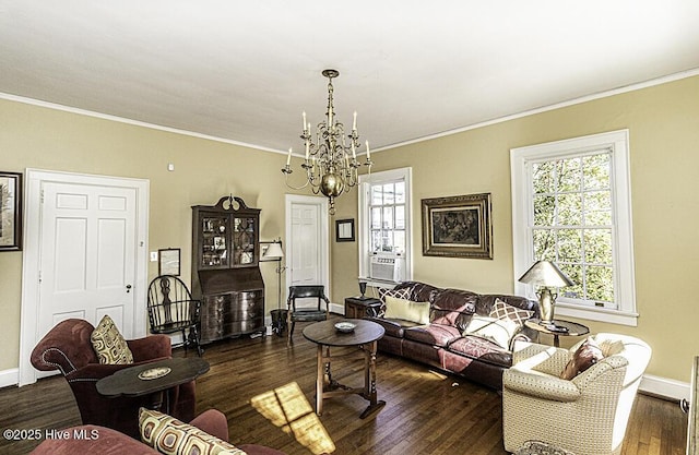 living room featuring dark hardwood / wood-style floors, crown molding, and a notable chandelier