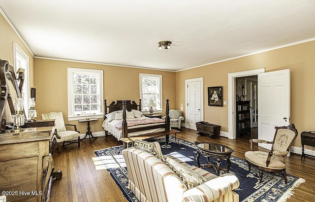 bedroom featuring dark wood-type flooring and ornamental molding