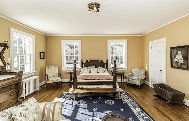 bedroom with dark wood-type flooring, radiator, and crown molding